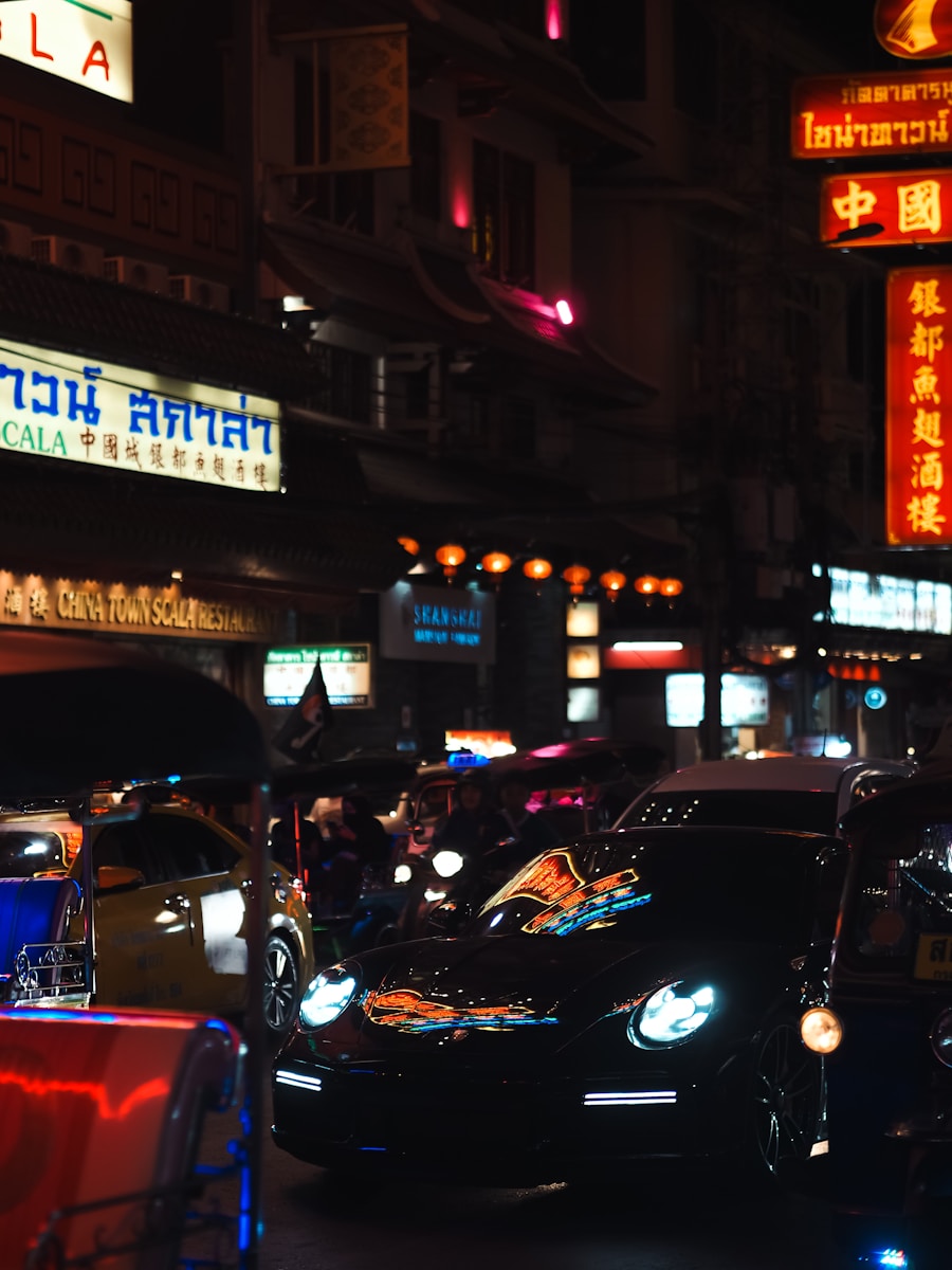 a city street filled with lots of traffic at night