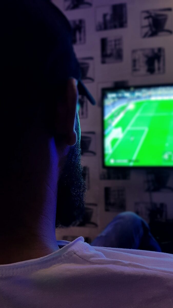 man watching soccer game